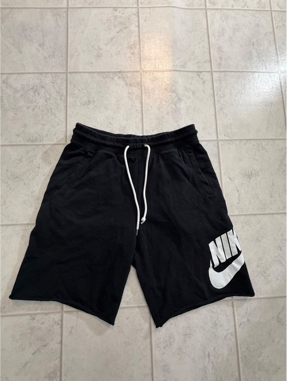 Nike black shorts with large white logo